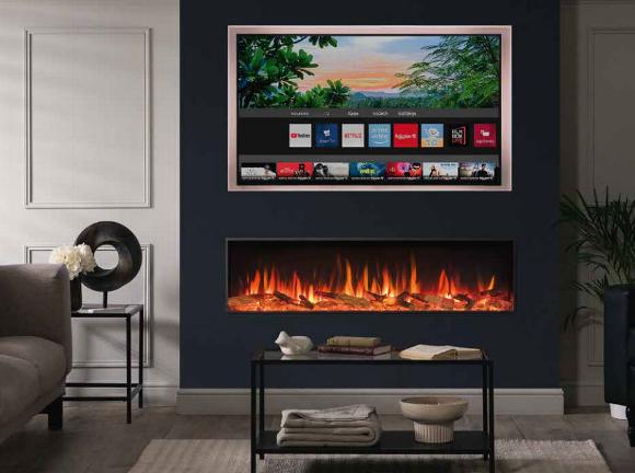wide feature electric fire set in wall below TV
