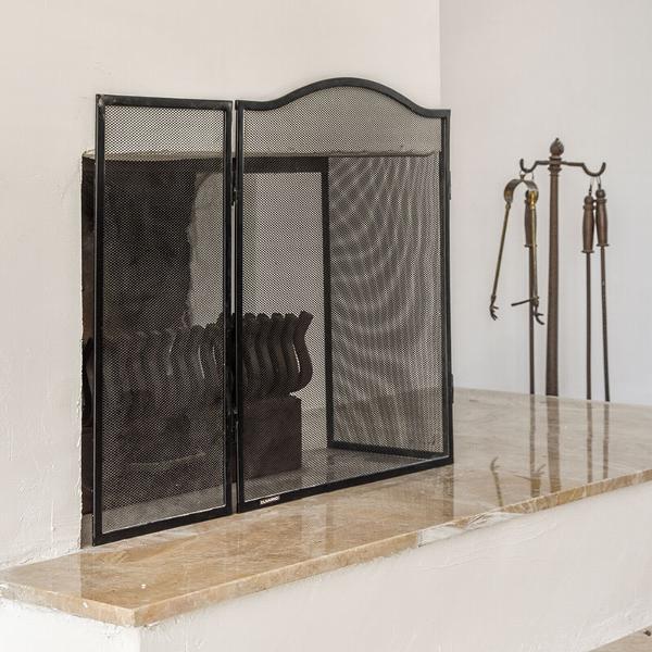 Minimal black mesh fire screen for open fire