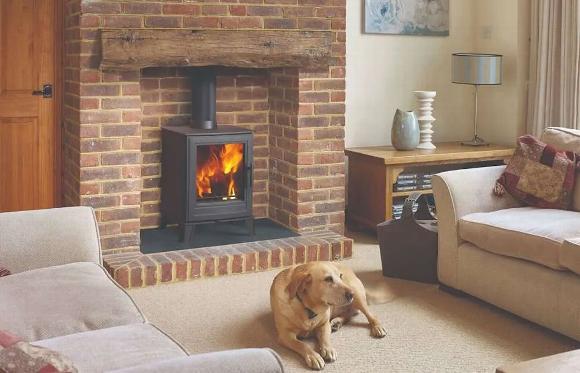Modern stove in brick fireplace